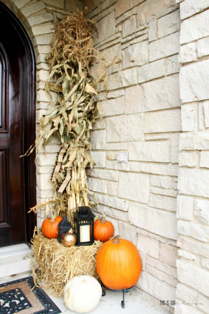 Tall cornstalks on the front porch with hay and pumpkins - Fall Front porch decorating ideas - This is our Bliss