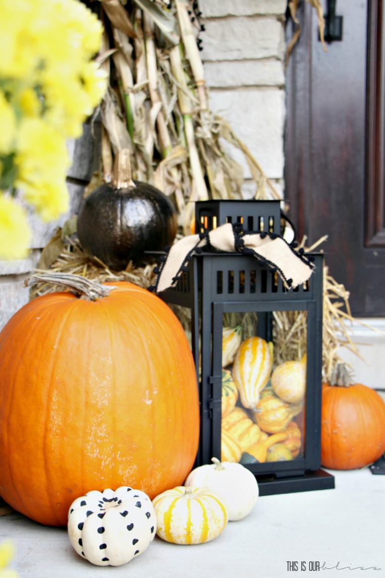 Fall front porch decorating ideas - diy painted pumpkins - dotted pumpkins with craft paint - Fall front porch with lanterns pumpkins hay and cornstalks This is our Bliss