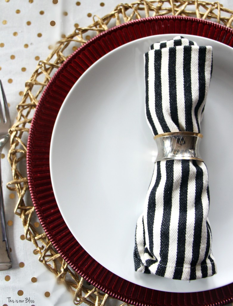 https://www.thisisourbliss.com/wp-content/uploads/2015/12/gold-polka-dot-red-ruffle-charger-plate-black-and-ivory-striped-napkin-merry-bright-and-blissful-holiday-home-christmas-table-thisisourbliss.com_-782x1024.jpg