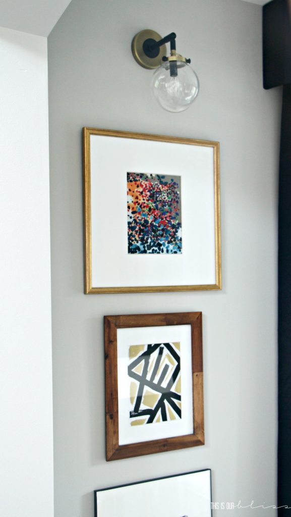 stacked-frames-under-sconces-dining-room-art-display This is our Bliss