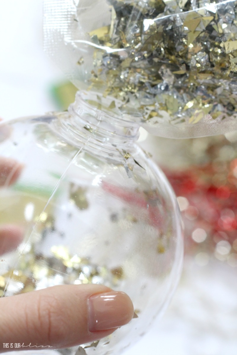DIY Dollar Store Ornament Place Card - Metallic confetti-filled ornaments on a bright, bold and festive Christmas Table!