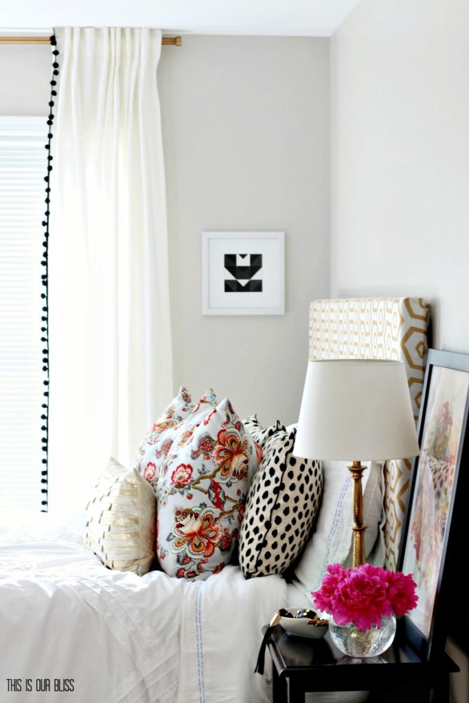 Bright and cheery guestroom with color, pattern and fresh flowers