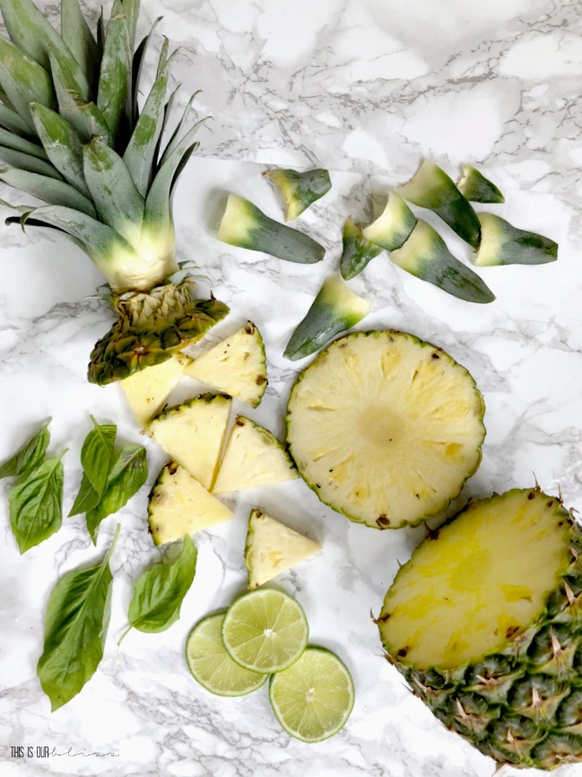 https://www.thisisourbliss.com/wp-content/uploads/2018/06/Fresh-Tropical-Fruit-ice-mold-Wine-chiller-using-pineapple-basil-lime-This-is-our-Bliss.jpg