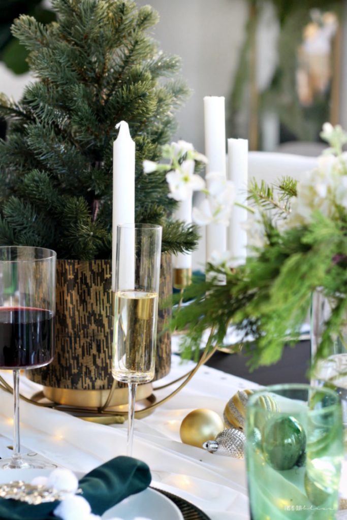 Christmas Tablescape - holiday hosting with wine fresh flowers and green white and gold placesettings - This is our Bliss
