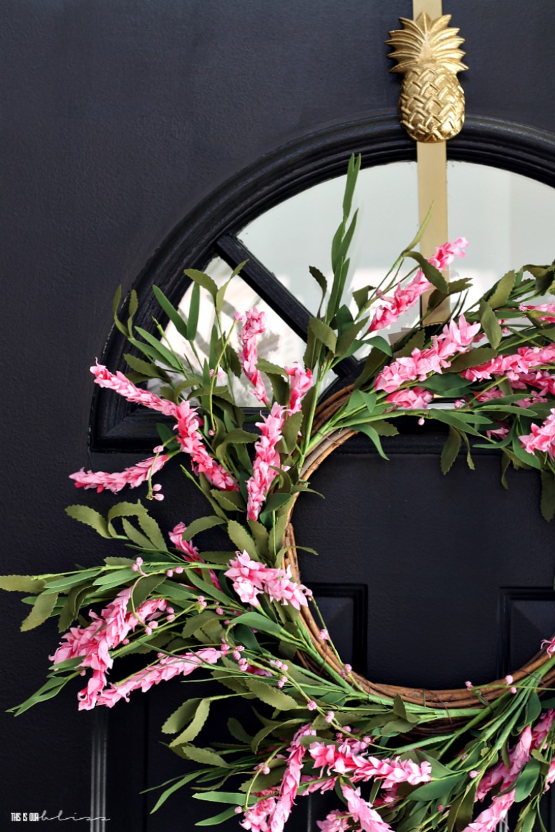 Simple Ways to freshen up your home for Spring - add a Pink floral front door wreath - This is our Bliss