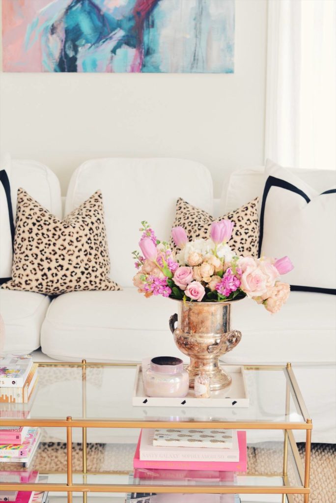 pink coffee table decor for Spring with leopard pillows