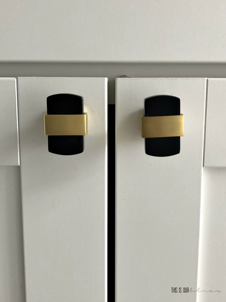 white laundry room cabinets with black and gold hardware - This is our Bliss