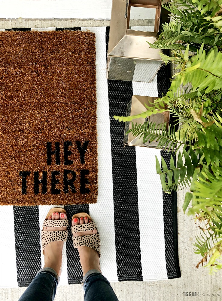 Layered rugs on the front porch - 13 ways to spruce up your front porch when you've ignored it for years - Hey There rug - This is our Bliss