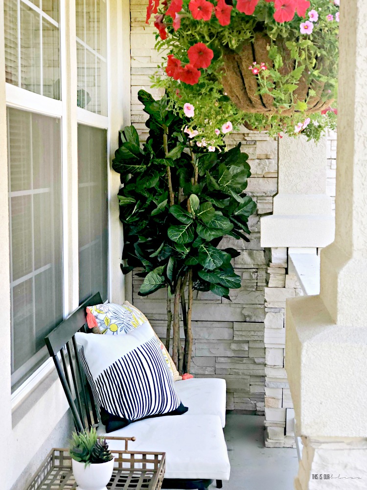 Outdoor decor on front porch with faux fiddle leaf fig hanging baskets and outdoor bench - how to spruce up your front porch - This is our Bliss