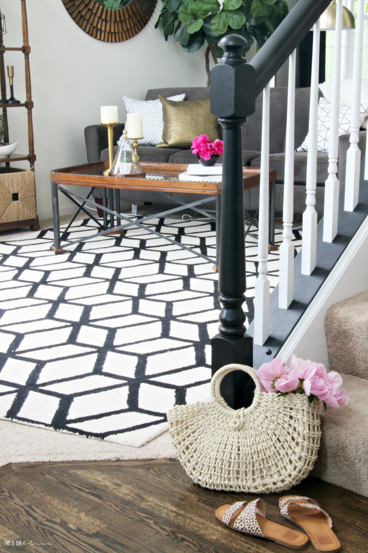 Summer Entryway with black and white staircase - This is our Bliss