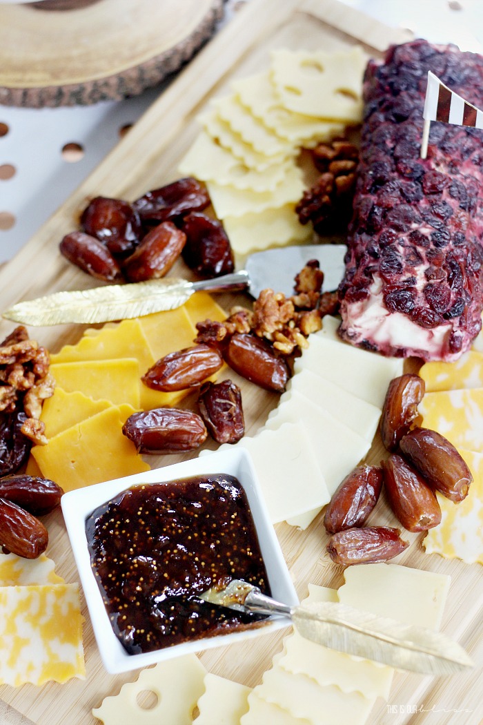 simple cheese board using sliced cheese pecans dates and fig spread - This is our Bliss
