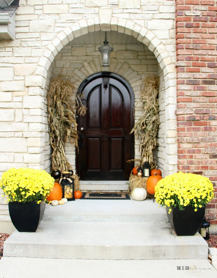Fall front porch with yellow mums white pumpkins orange pumpkins lanterns cornstalks - This is our Bliss