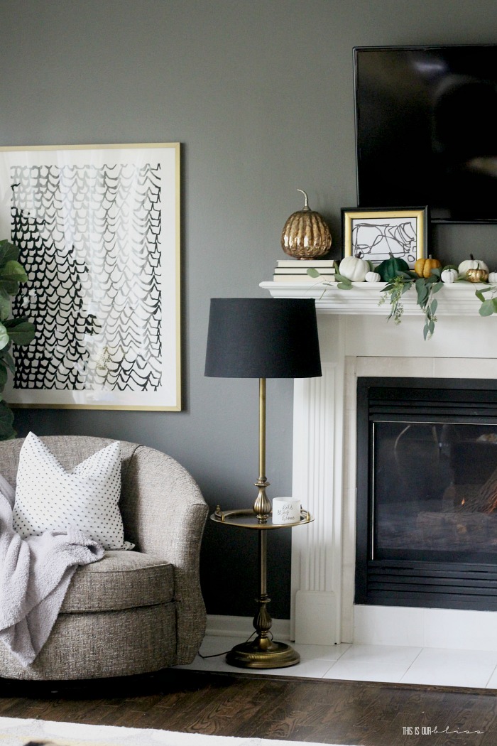 cozy fall mantel with draping eucalyptus leaves and pumpkins - This is our Bliss