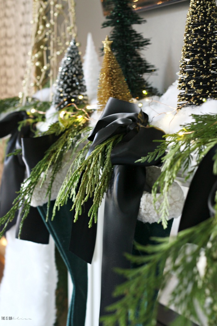 How to style a simple and elegant mantel for Christmas with fresh garland and satin ribbon - This is our Bliss