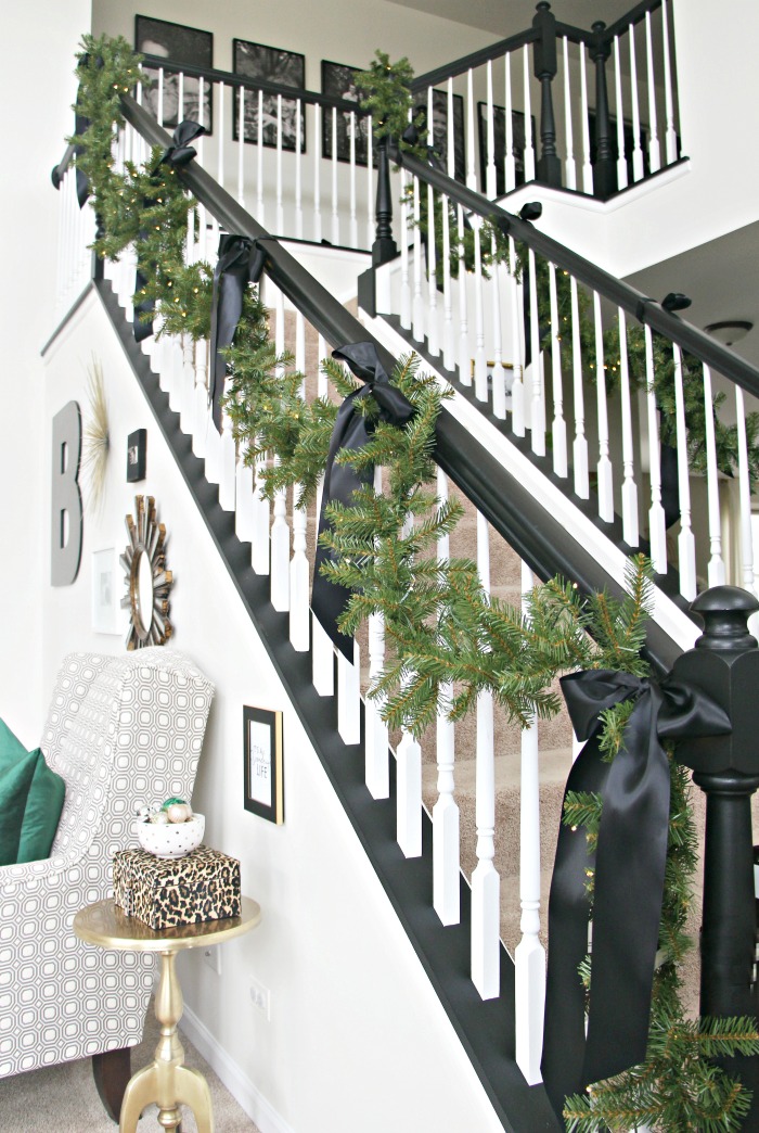 Garland and satin bows on the staircase - simple and elegant Christmas decor - garland on stairs - This is our Bliss