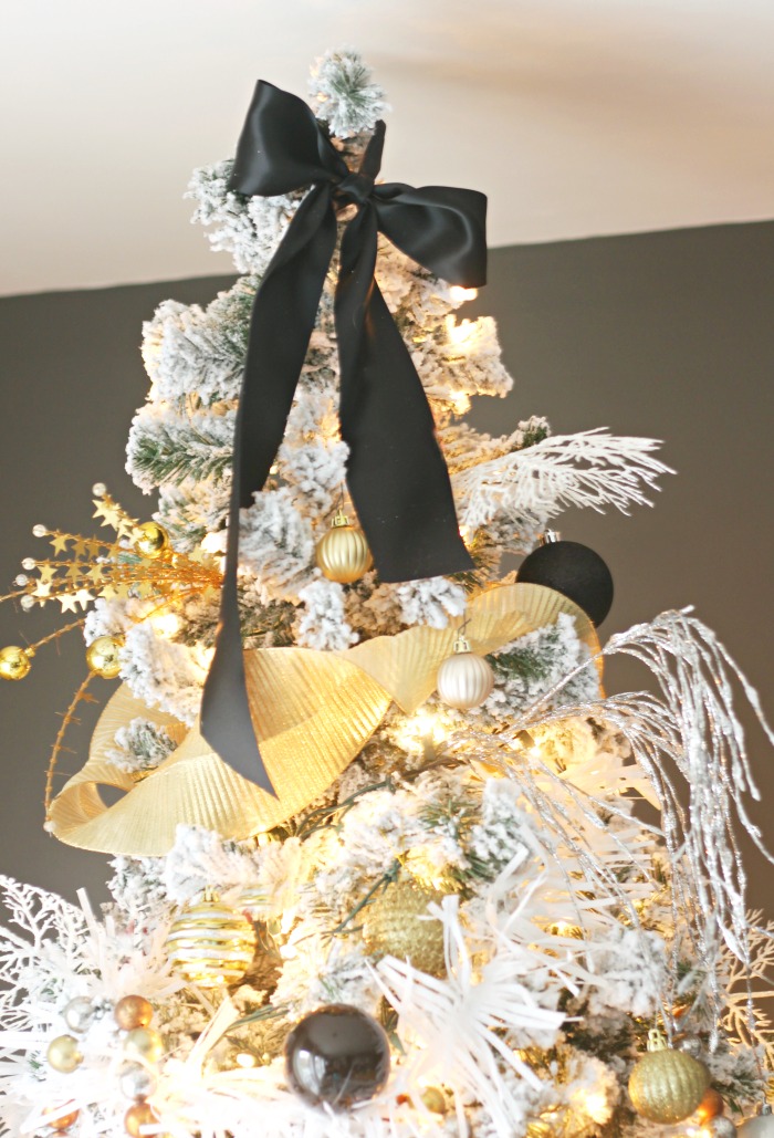 Simple black satin bow as Christmas tree topper - This is our Bliss