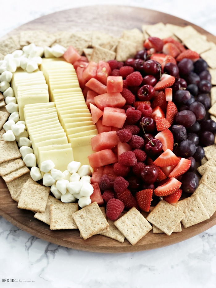 fruit and cheese charcuterie board in a heart shape - This is our Bliss