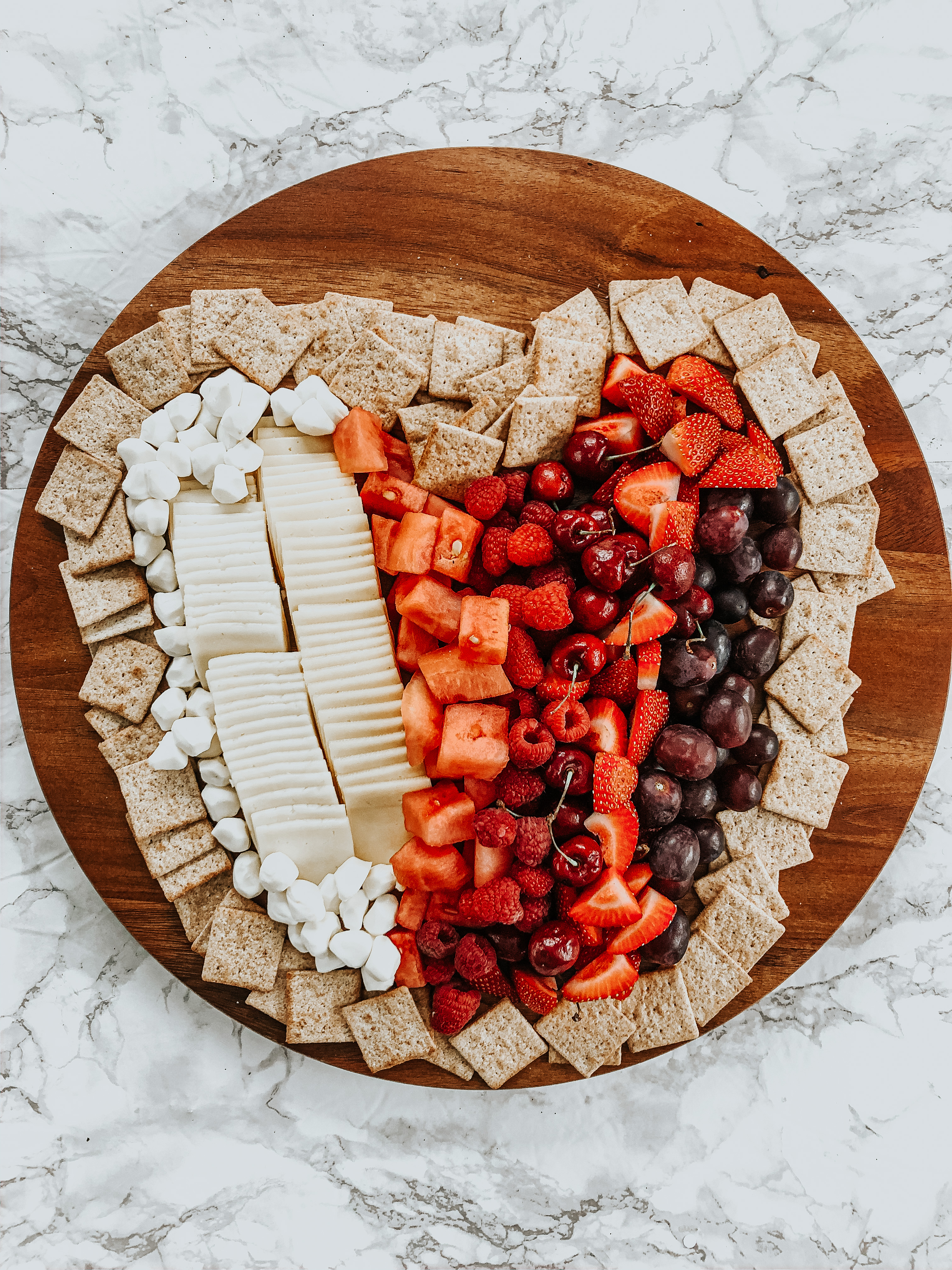 heart shaped charcuterie board with cheese crackers and fruit - This is our Bliss #charcuterieboard #galentinesdayideas #heartplatter #heartappetizerideas #charcuterieideas