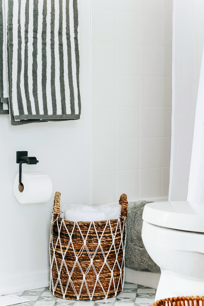 Neutral and modern shared boys bathroom with striped towels and white walls - This is our Bliss