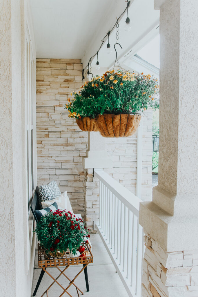 hanging mums in baskets on small front porch - Fall front porch ideas - This is our Bliss