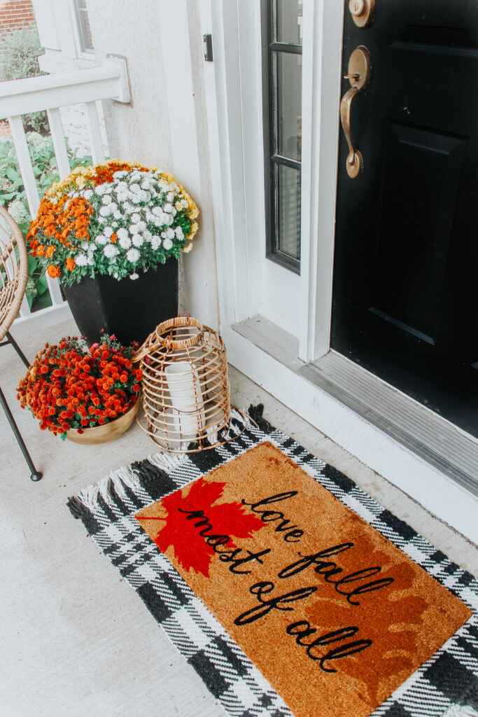 love fall most of all doormat with plaid Studio McGee outdoor rug underneath - rug layering ideas - This is our Bliss