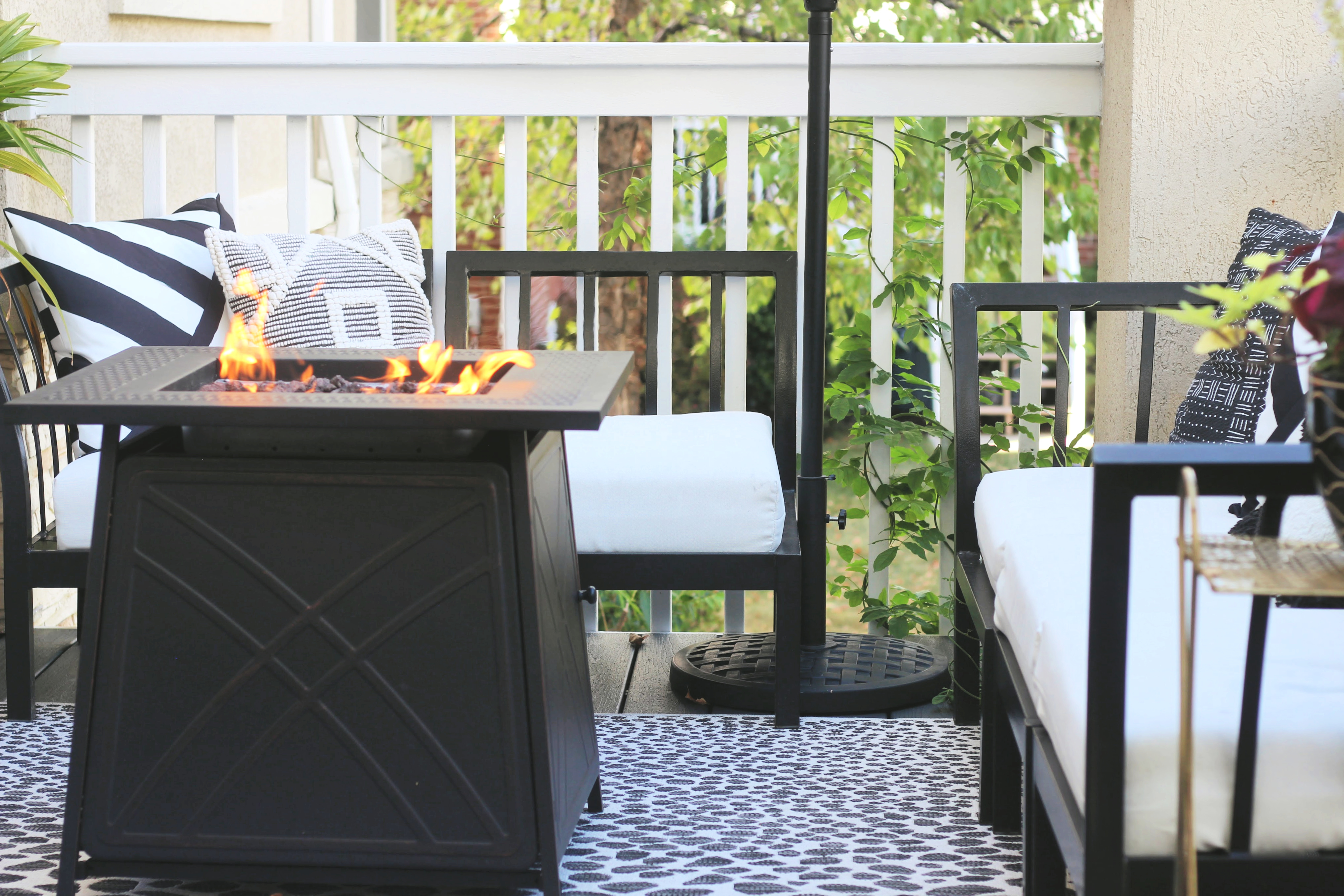 cozy back deck reveal with firepit table - neutral outdoor space - This is our Bliss