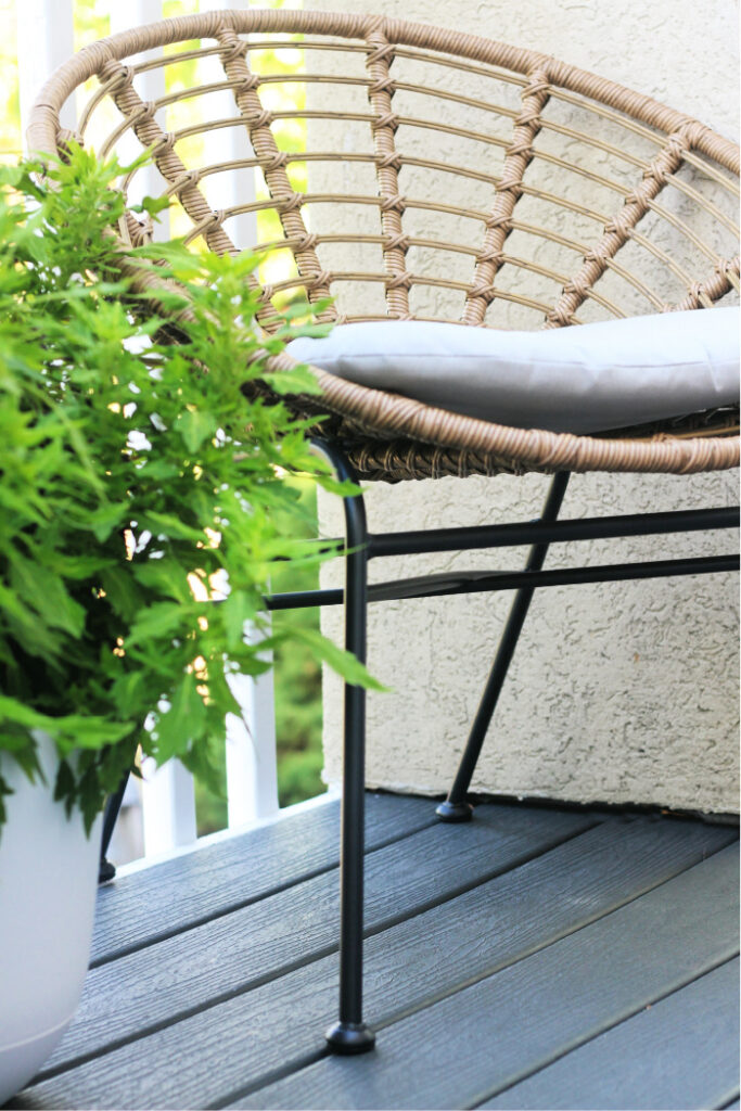 rattan chair on gray trex deck - This is our Bliss