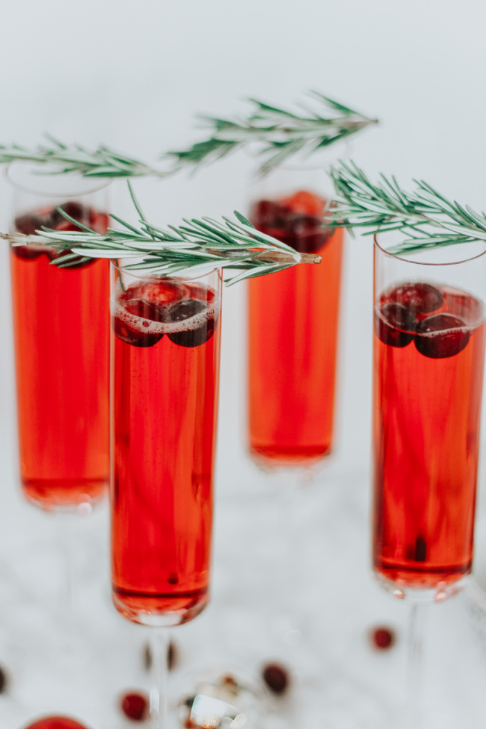 Holiday drink ideas - Cranberry mimosas - Christmas morning mimosas - This is our Bliss frozen cranberry floaters in mimosa - #holidaymimosa #cranberrycocktailrecipes