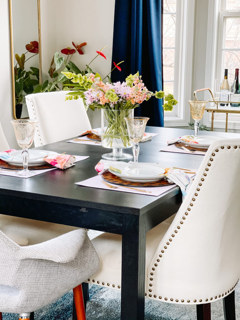 Spring dining room decor - light and airy Dining Room with ivory upholstered chairs and navy blue curtain panels - This is our Bliss