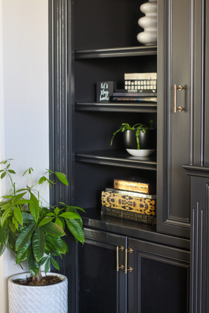 black built-ins styled with decorative objects - This is our Bliss