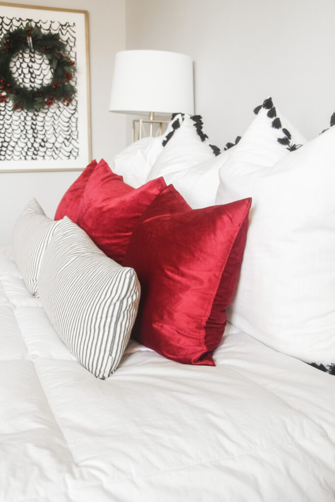 red pillow covers in the bedroom for a touch of holiday flair - This is our Bliss