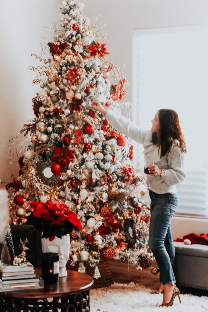flocked tree with red white and metallic ornaments - This is our Bliss