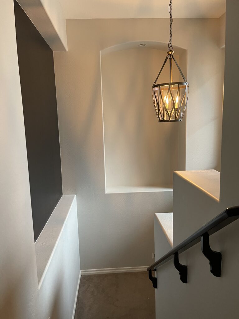 painted stair railing and stairwell niche - tricorn black paint - This is our Bliss