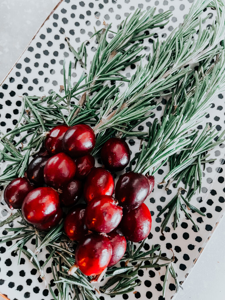 festive holiday cocktail with a cranberry & rosemary skewer - this easy holiday drink hack! This is our Bliss